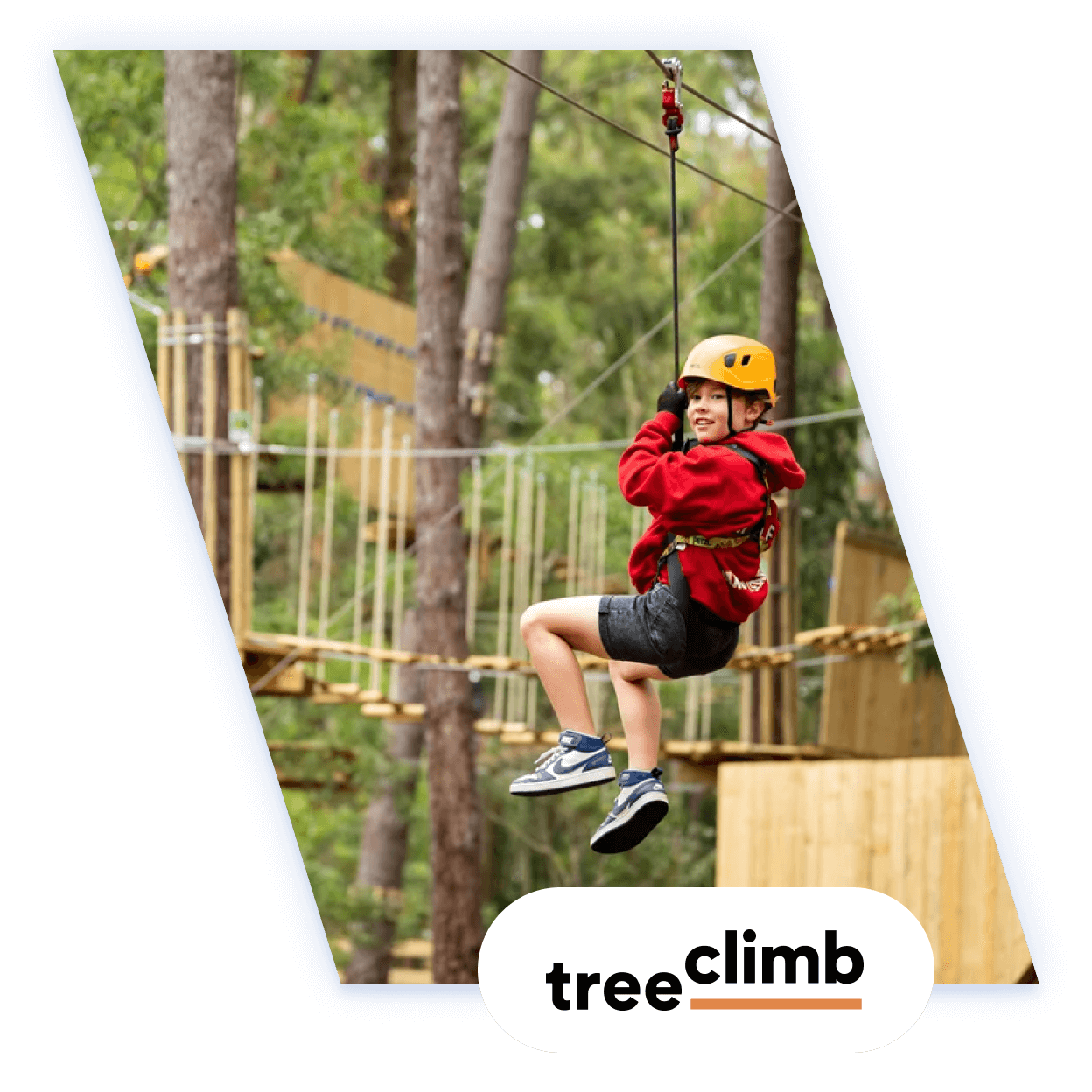Boy on ropes course at TreeClimb 